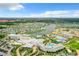 Aerial view of resort community with lake and multiple pools at 8035 Surf St, Kissimmee, FL 34747