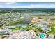 Aerial view of resort community with lake and pools at 8035 Surf St, Kissimmee, FL 34747