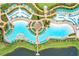 Aerial view of resort pool with surrounding lounge chairs at 8035 Surf St, Kissimmee, FL 34747