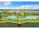 Aerial view of resort with large pool and lake at 8035 Surf St, Kissimmee, FL 34747