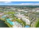 Aerial view of large resort complex with pools and lake at 8035 Surf St, Kissimmee, FL 34747