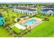Aerial view of community pool and surrounding townhomes at 8035 Surf St, Kissimmee, FL 34747