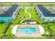 Aerial view showing community pool and townhome buildings at 8035 Surf St, Kissimmee, FL 34747