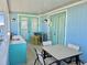 Outdoor balcony with table, chairs, and wet bar at 8035 Surf St, Kissimmee, FL 34747
