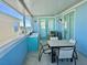 Outdoor balcony with table and chairs at 8035 Surf St, Kissimmee, FL 34747
