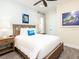 Cozy bedroom featuring a full-size bed and beach-themed decor at 8035 Surf St, Kissimmee, FL 34747