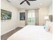 Bright bedroom with a comfy queen-size bed, TV, and large window at 8035 Surf St, Kissimmee, FL 34747