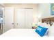 Bedroom with a queen bed, nightstand and sliding door to closet at 8035 Surf St, Kissimmee, FL 34747
