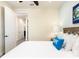 Spacious bedroom with a queen bed and access to hallway at 8035 Surf St, Kissimmee, FL 34747