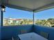 Covered patio with table and chairs, offering scenic views at 8035 Surf St, Kissimmee, FL 34747