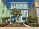 Beautiful two-story home with light blue exterior and palm trees at 8035 Surf St, Kissimmee, FL 34747