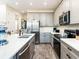 Modern kitchen with stainless steel appliances and an island at 8035 Surf St, Kissimmee, FL 34747