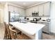 Modern kitchen with gray cabinets and a large island at 8035 Surf St, Kissimmee, FL 34747