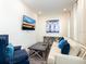 Living room with sofa, coffee table and arm chair at 8035 Surf St, Kissimmee, FL 34747