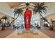 Grand lobby featuring a large red flip-flop sculpture at 8035 Surf St, Kissimmee, FL 34747
