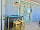 Outdoor patio bar with colorful stools, perfect for entertaining at 8035 Surf St, Kissimmee, FL 34747
