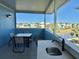 Outdoor patio with table, chairs, and a built-in sink at 8035 Surf St, Kissimmee, FL 34747