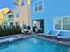 Private pool and spa with patio furniture and nearby homes at 8035 Surf St, Kissimmee, FL 34747