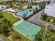 Aerial view of community basketball court near pool and residential buildings at 8518 Sperry St, Orlando, FL 32827