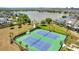 Aerial view of two community tennis courts with people playing at 8518 Sperry St, Orlando, FL 32827