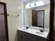 Double vanity bathroom with large mirror and shower at 8568 Park Highland Dr, Orlando, FL 32818