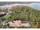 Luxury estate on a waterfront lot with lush landscaping and private access at 9301 Tibet Pointe Cir, Windermere, FL 34786