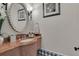 Powder room with marble vanity and decorative mirror at 9301 Tibet Pointe Cir, Windermere, FL 34786