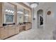 Spacious bathroom with and vanities and a large mirror at 9301 Tibet Pointe Cir, Windermere, FL 34786
