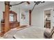 Luxurious bedroom with four-poster bed, ornate dresser, and ensuite bathroom at 9301 Tibet Pointe Cir, Windermere, FL 34786