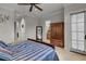 Well-lit bedroom with wooden furniture and a ceiling fan at 9301 Tibet Pointe Cir, Windermere, FL 34786