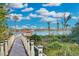 Scenic boardwalk offering peaceful views of a lake and lush greenery at 9301 Tibet Pointe Cir, Windermere, FL 34786