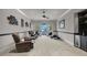 Bonus room or den with plush carpeting, lake views, and a wet bar at 9301 Tibet Pointe Cir, Windermere, FL 34786