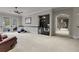 Second view of the bonus room showcasing the wet bar, hallway access, and ample space at 9301 Tibet Pointe Cir, Windermere, FL 34786