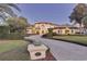Home exterior with a driveway, landscaping, and lighting at 9301 Tibet Pointe Cir, Windermere, FL 34786