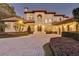 Beautiful Mediterranean home exterior with circular driveway and lush landscaping at 9301 Tibet Pointe Cir, Windermere, FL 34786