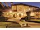 Stunning Mediterranean-style home exterior at twilight at 9301 Tibet Pointe Cir, Windermere, FL 34786