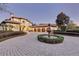 Elegant home with circular driveway, fountain, and landscaped gardens at 9301 Tibet Pointe Cir, Windermere, FL 34786
