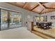 Game room with pool table, access to the pool area, wood ceiling and sliding glass doors at 9301 Tibet Pointe Cir, Windermere, FL 34786
