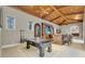 Game room features a ping pong table and wet bar at 9301 Tibet Pointe Cir, Windermere, FL 34786