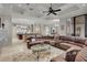 Spacious living room boasts a large sectional sofa and fireplace at 9301 Tibet Pointe Cir, Windermere, FL 34786