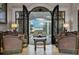 Open living area with double doors leading to a relaxing patio and lake view at 9301 Tibet Pointe Cir, Windermere, FL 34786