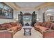 Spacious living room with two sofas and views of the pool and patio at 9301 Tibet Pointe Cir, Windermere, FL 34786