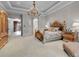 Luxurious main bedroom suite with sitting area and access to office at 9301 Tibet Pointe Cir, Windermere, FL 34786