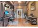 Elegant home office with dark wood built-ins, dual workstations, and a view into the hallway at 9301 Tibet Pointe Cir, Windermere, FL 34786