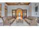 Outdoor patio with seating and view into the home at 9301 Tibet Pointe Cir, Windermere, FL 34786