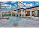 Spacious pool with fireplace, entertainment area, and screened enclosure at 9301 Tibet Pointe Cir, Windermere, FL 34786