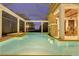 Inviting pool area with fireplace, bar, and dining area at 9301 Tibet Pointe Cir, Windermere, FL 34786