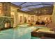 Spectacular pool with spa, fireplace, and outdoor living space at 9301 Tibet Pointe Cir, Windermere, FL 34786