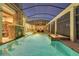 Spacious covered pool area with spa, fireplace, and outdoor seating at 9301 Tibet Pointe Cir, Windermere, FL 34786