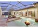 Screened pool with fire pit, spa, and view of interior living space at 9301 Tibet Pointe Cir, Windermere, FL 34786